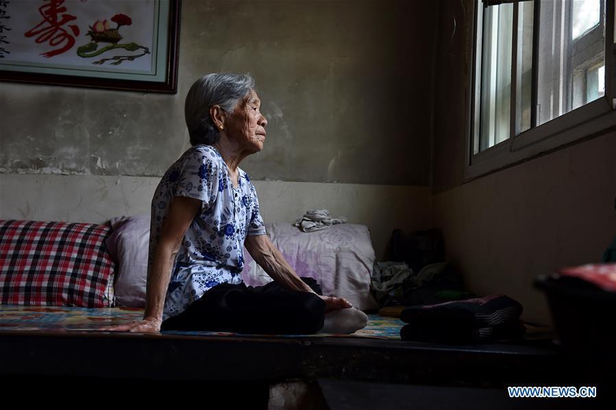Liu Fenghai sits on the bed on Aug. 3, 2016. Liu died at the age of 90 in Nanyuan Village of Qinxian County, north China\'s Shanxi Province, Jan. 20, 2017. In the spring of 1943, Liu Fenghai and villager Liu Yuegui were captured and being raped by Japanese invaders. They were thrown into a valley several days later. Liu Fenghai never received the apology she longed for in her lifetime. Women forced into sexual slavery by the Imperial Japanese Army before and during World War II were called \
