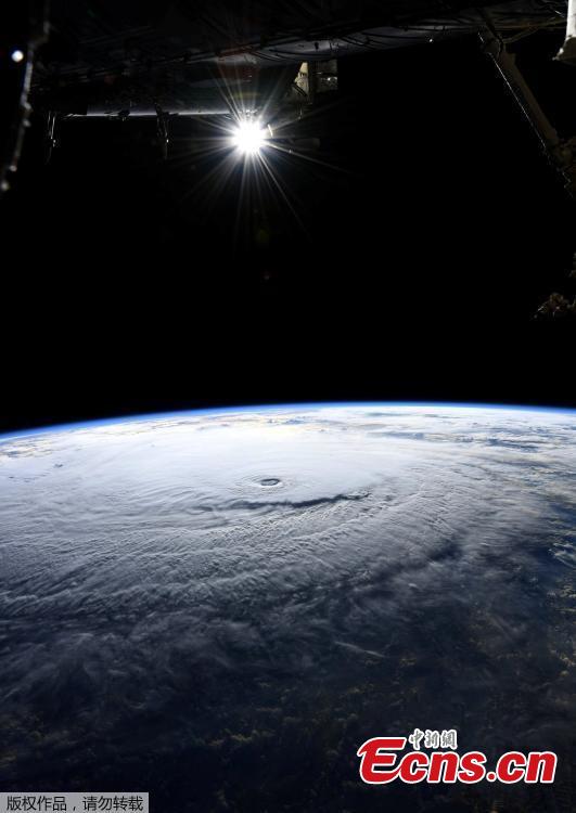 A handout image made available by NASA and taken by an Expedition 56 crew member from the International Space Station shows Hurricane Lane in the Central Pacific Ocean, near Hawaii, Aug. 22, 2018. Hurricane Lane weakened to a Category 3 storm on Thursday but was already lashing Hawaii with high winds and torrential rains, touching off flash floods, landslides and raging surf as residents hunkered down to ride out the storm. (Photo/Agencies)