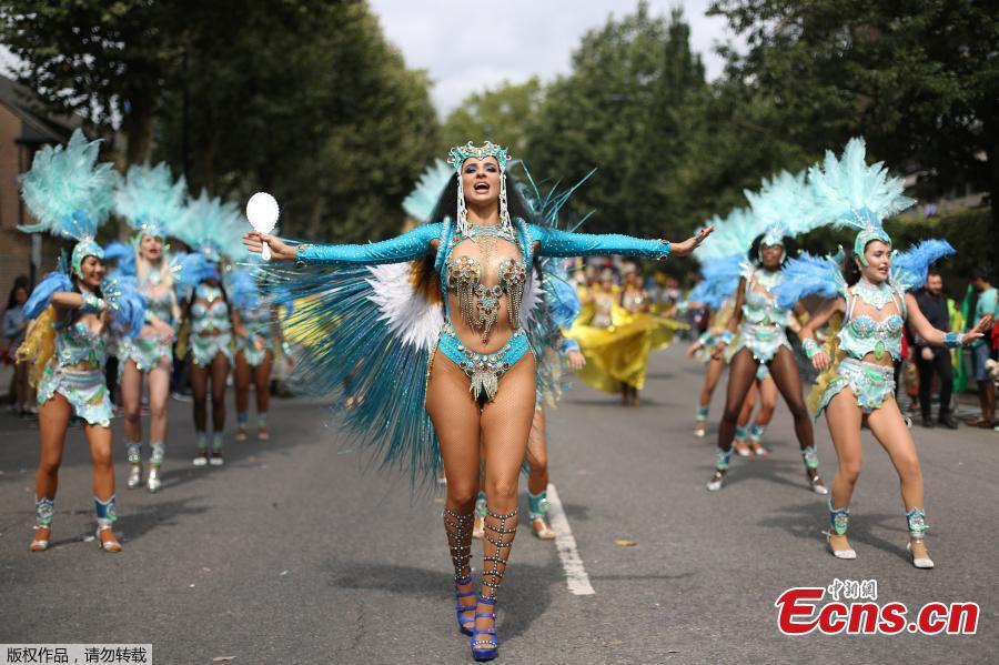 Revelers take part in the Notting Hill Carnival in London, Britain August 27, 2018. The Notting Hill Carnival is a symbol of interracial tolerance which dates back to the 1960s and celebrates the Afro-Caribbean community. (Photo/Agencies)
