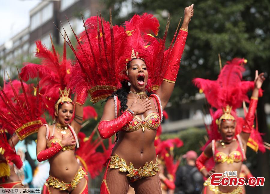 Revelers take part in the Notting Hill Carnival in London, Britain August 27, 2018. The Notting Hill Carnival is a symbol of interracial tolerance which dates back to the 1960s and celebrates the Afro-Caribbean community. (Photo/Agencies)