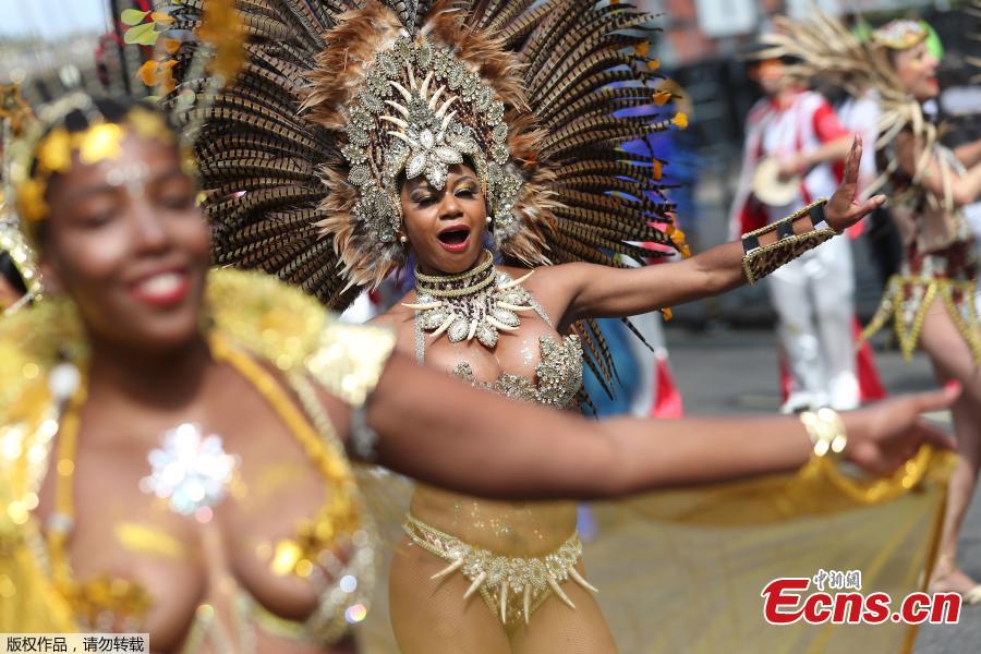 Revelers take part in the Notting Hill Carnival in London, Britain August 27, 2018. The Notting Hill Carnival is a symbol of interracial tolerance which dates back to the 1960s and celebrates the Afro-Caribbean community. (Photo/Agencies)