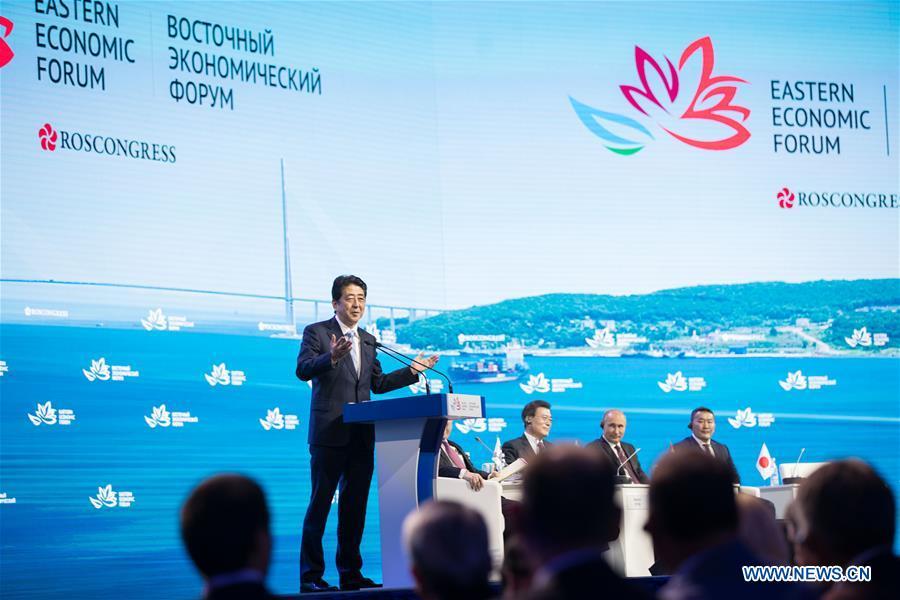 Japanese Prime Minister Shinzo Abe (L) speaks on the plenary session of the third Eastern Economic Forum in Vladivostok, Russia, on Sept. 7, 2017. (Xinhua/Wu Zhuang)