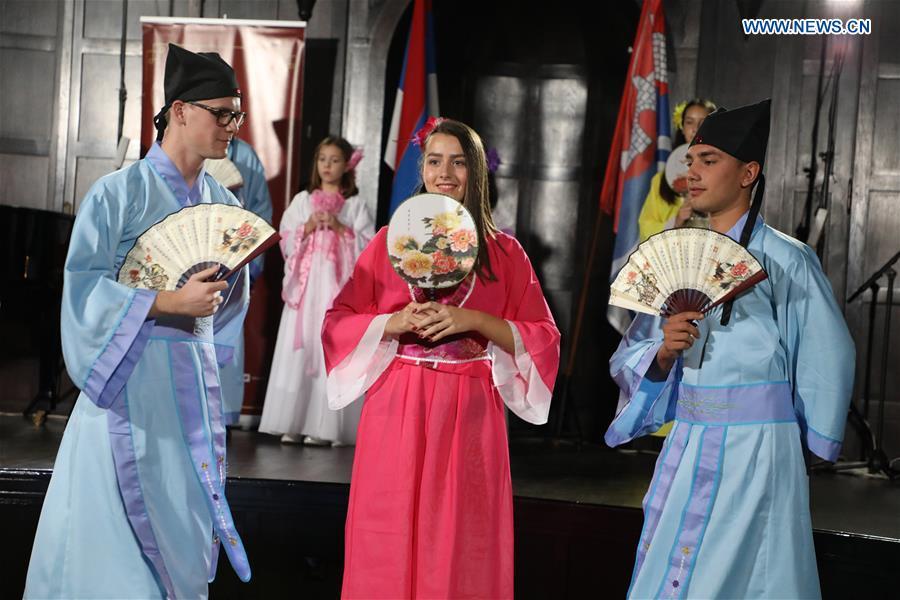 Students of the Confucius Institute of Banja Luka University dance in Chinese traditional costumes in Banja Luka, Bosnia and Herzegovina, on Sept. 22, 2018. The Confucius Institute of Banja Luka University organized a series of interactive workshops on the occasion of the Day of Confucius Institutes through a diverse program of activities in promoting Chinese culture here on Saturday. (Xinhua/Haris Memija)