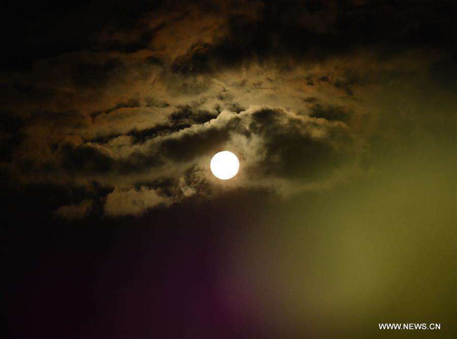Photo taken on Sept. 24, 2018 shows the full moon in Shuijing Village of Xundian County, southwest China\'s Yunnan Province. The Mid-Autumn Festival, which falls on Sept. 24 this year, is a traditional Chinese festival with a custom of family reunion. (Xinhua/Yang Zongyou)