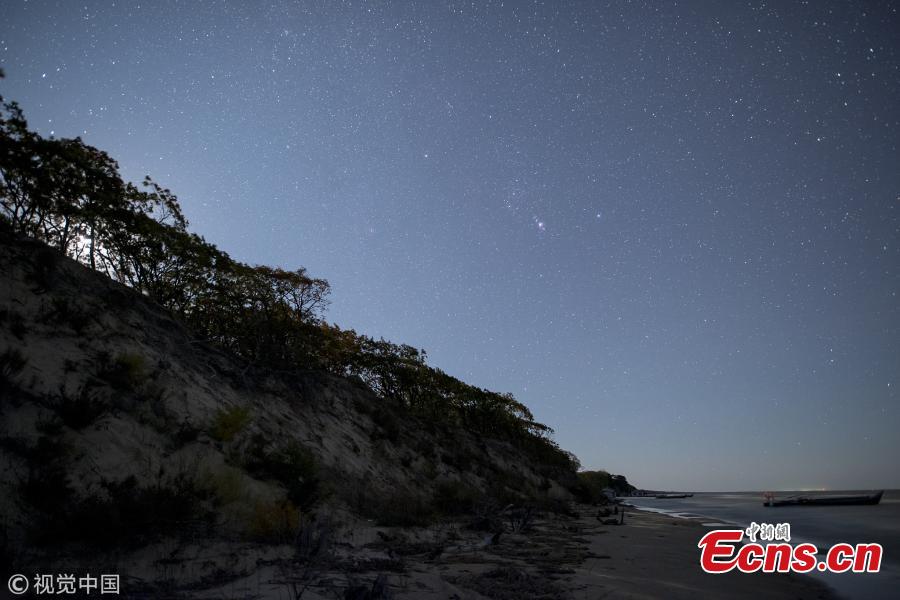 A photo taken on Oct. 3 and 4, 2018 shows the stars in the Milk Way over Xingkai Lake on the border between China and Russia, in Jixi City, Northeast China’s Heilongjiang Province. The lake is known as a great place to observe the stars at night. (Photo/VCG)