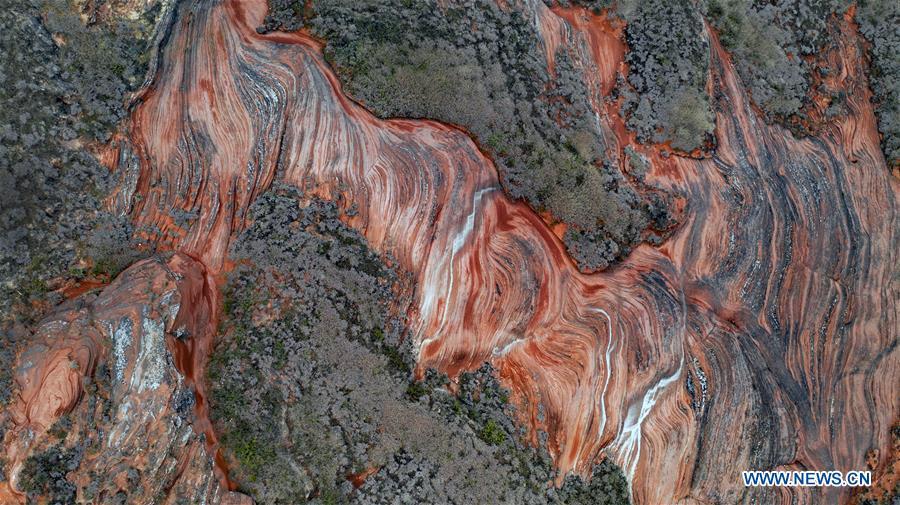 Aerial photo taken on Oct. 21, 2018 shows a view of Danxia landform at Wangjiawan of Pingqiao Town in Ansai District of Yan\'an, northwest China\'s Shaanxi Province. Danxia landform is a unique type of geomorphology formed from red-colored sandstones and characterized by steep cliffs. (Xinhua/Tao Ming)