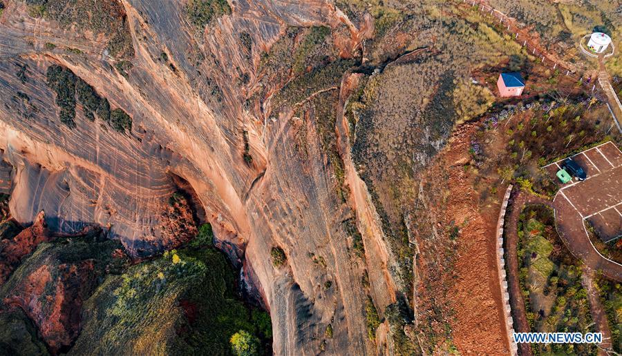 Aerial photo taken on Oct. 21, 2018 shows a view of Danxia landform at Wangjiawan of Pingqiao Town in Ansai District of Yan\'an, northwest China\'s Shaanxi Province. Danxia landform is a unique type of geomorphology formed from red-colored sandstones and characterized by steep cliffs. (Xinhua/Tao Ming)