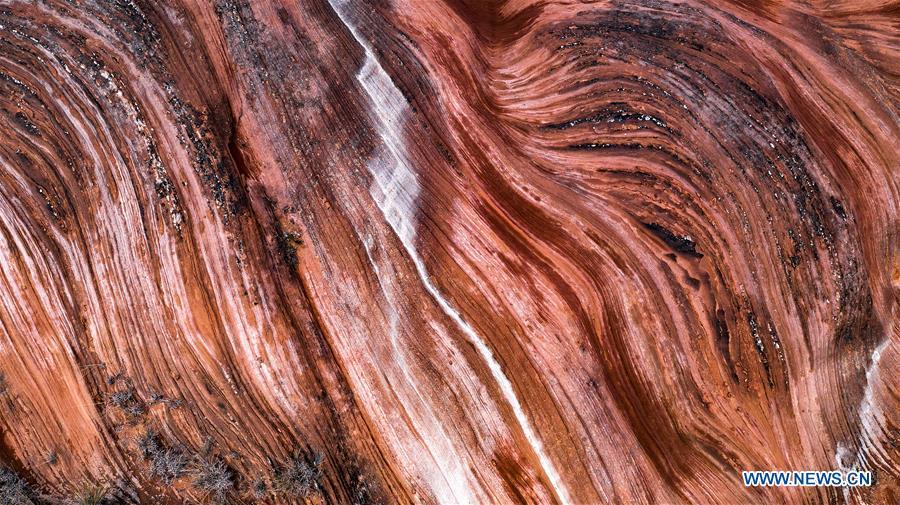 Aerial photo taken on Oct. 21, 2018 shows a view of Danxia landform at Wangjiawan of Pingqiao Town in Ansai District of Yan\'an, northwest China\'s Shaanxi Province. Danxia landform is a unique type of geomorphology formed from red-colored sandstones and characterized by steep cliffs. (Xinhua/Tao Ming)
