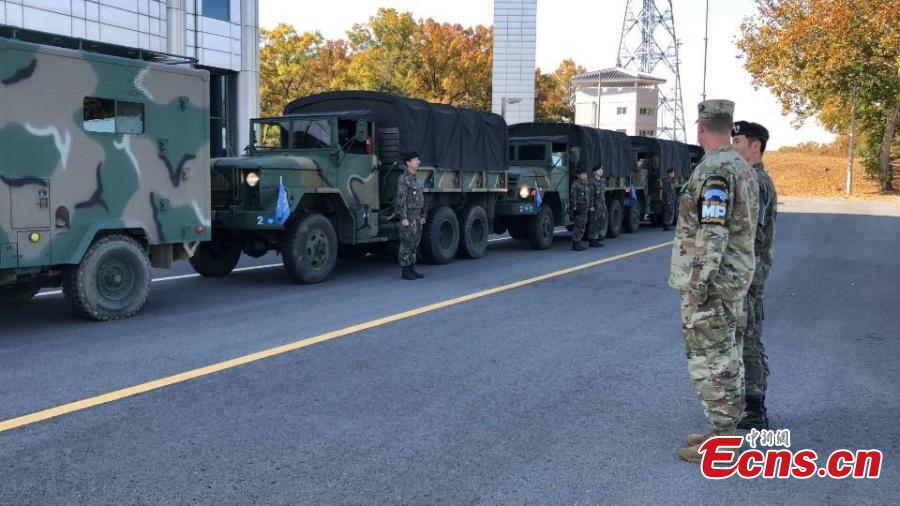 In this photo provided by South Korea Defense Ministry, a U.S. and a South Korean army soldiers stand before leaving from the border village of Panmunjom, South Korea, Oct. 25, 2018. Koreas completed withdrawing firearms and troops from a jointly controlled area at the Koreas\' border village on Thursday as part of their sweeping agreements to reduce decades-long military animosities on the Korean Peninsula. (Photo/Agencies)