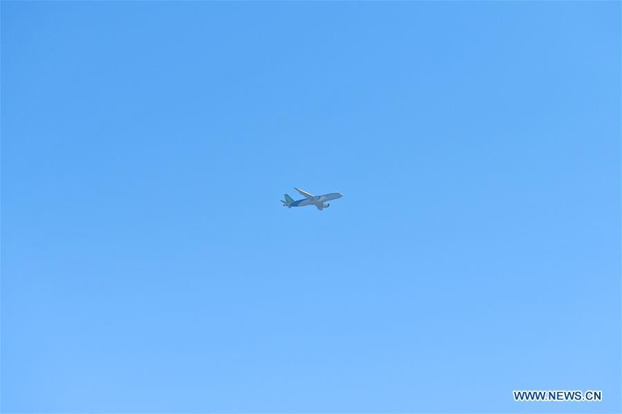 The No.102 C919 plane flies over the Nanchang Yaohu Airport, east China\'s Jiangxi Province, Oct. 27, 2018. The No.102 C919 plane landed at Nanchang Yaohu Airport after a flight from Dongying Shengli Airport of east China\'s Shandong Province. The plane will undergo rigorous tests at this airport. (Xinhua/Hu Chenhuan)