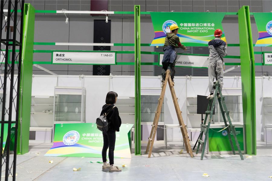 Stands of French food supplements and nutritional products provider Laboratoire Cevrai and German food supplements and dietary foods provider Orthomol are seen under construction. (Photo/chinadaily.com.cn)