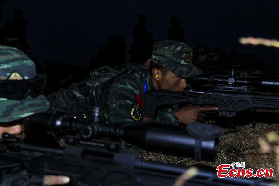 Snipers from a special unit of the Chinese People\'s Armed Police Force sharp their skills during a training at Songshan Mountain, Central China’s Henan province. (Photo: China News Service/ Zhao Hongtao)