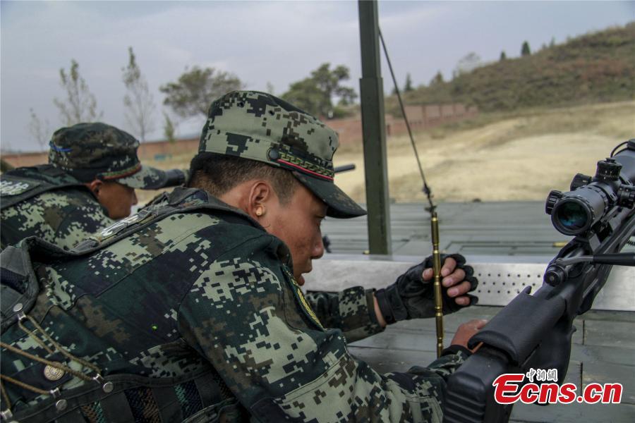 Snipers from a special unit of the Chinese People\'s Armed Police Force sharp their skills during a training at Songshan Mountain, Central China’s Henan province. (Photo: China News Service/ Zhao Hongtao)