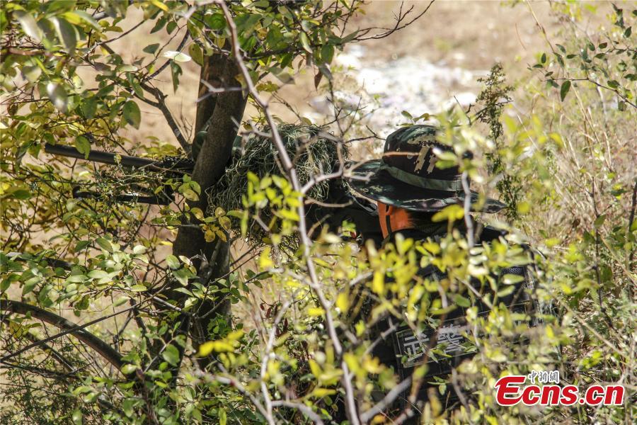 Snipers from a special unit of the Chinese People\'s Armed Police Force sharp their skills during a training at Songshan Mountain, Central China’s Henan province. (Photo: China News Service/ Zhao Hongtao)
