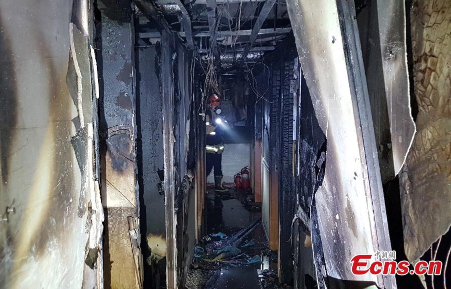 A fire at a low-cost dormitory-style housing facility in central Seoul, South Korea, is put out on Nov. 9, 2018. The fire killed at least seven people and injured 11. Authorities are investigating possible safety lapses in the building. (Photo providedto China News Service)