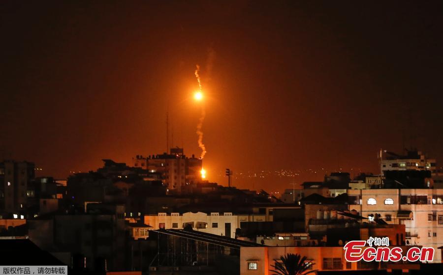 A picture taken on November 12, 2018 shows flares dropped by Israeli warplanes above Gaza city.  Israel\'s military said it was carrying out air strikes \
