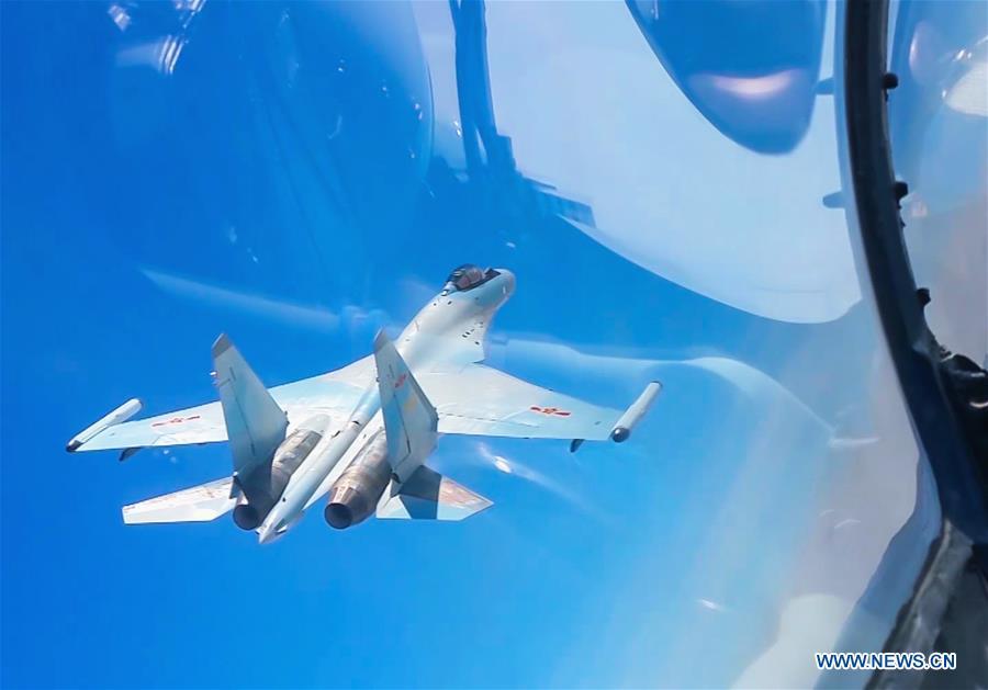 File photo shows the People\'s Liberation Army (PLA) Air Force conducting a joint combat patrol mission in the South China Sea. The Chinese Air Force announced a roadmap for building a stronger modern air force in three steps. The building of a stronger modern air force is in line with the overall goal of building national defense and the armed forces, Lieutenant General Xu Anxiang, deputy commander of Chinese Air Force, said at a press conference on celebrating the 69th anniversary of the establishment of Chinese Air Force held in Zhuhai, south China\'s Guangdong Province, Nov. 11, 2018. (Xinhua)
