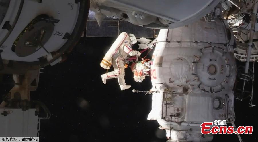 In this image from video made available by NASA, Russian cosmonauts Oleg Kononenko and Sergei Prokopyev perform a spacewalk outside the International Space Station on Tuesday, Dec. 11, 2018. (Photo/Agencies)
Two Russian cosmonauts have ventured outside the International Space Station today to inspect a section of a Russian spacecraft where a small hole was spotted. The mysterious leak was discovered on August 30 in the Russian Soyuz craft which is attached to the ISS. It was initially believed to have been caused by a small meteorite and astronauts used tape to seal the leak after it caused a minor loss of pressure. Now, the two astronauts have confirmed the hole is safe - and the craft will be used again.