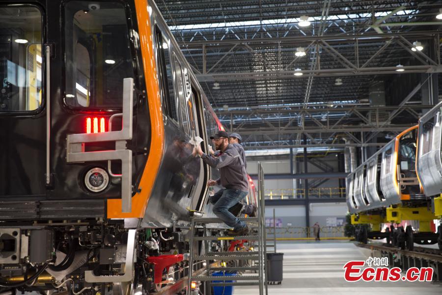 CRRC, a leading manufacturer of locomotives and rolling stock in China, rolls out the first train from its factory in Springfield, Massachusetts, the United States. The Chinese company supplies trains to the Massachusetts state transportation authority for use on Boston\'s Red and Orange subway lines. (Photo: China News Service/Liao Pan)