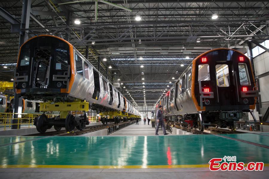 CRRC, a leading manufacturer of locomotives and rolling stock in China, rolls out the first train from its factory in Springfield, Massachusetts, the United States. The Chinese company supplies trains to the Massachusetts state transportation authority for use on Boston\'s Red and Orange subway lines. (Photo: China News Service/Liao Pan)