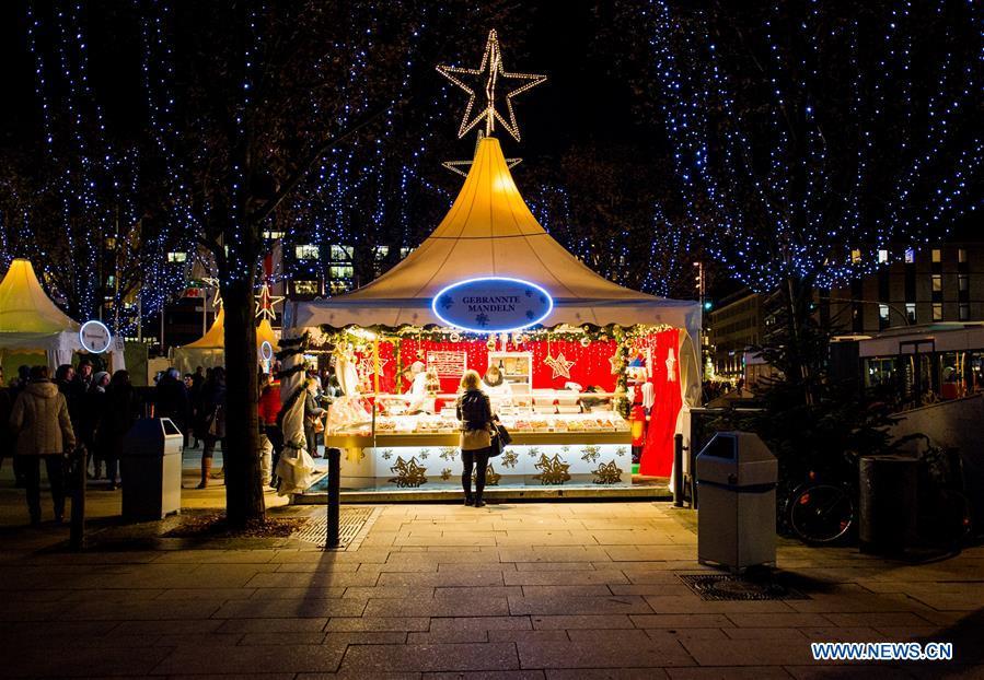 People visit a Christmas market in Hamburg, Germany, Dec. 18, 2018. There are more than 10 Christmas markets in Hamburg at present, making it a famous winter tourist city in Germany. (Xinhua/Lian Zhen)