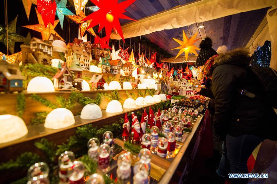 People visit a Christmas market in Hamburg, Germany, Dec. 18, 2018. There are more than 10 Christmas markets in Hamburg at present, making it a famous winter tourist city in Germany. (Xinhua/Lian Zhen)