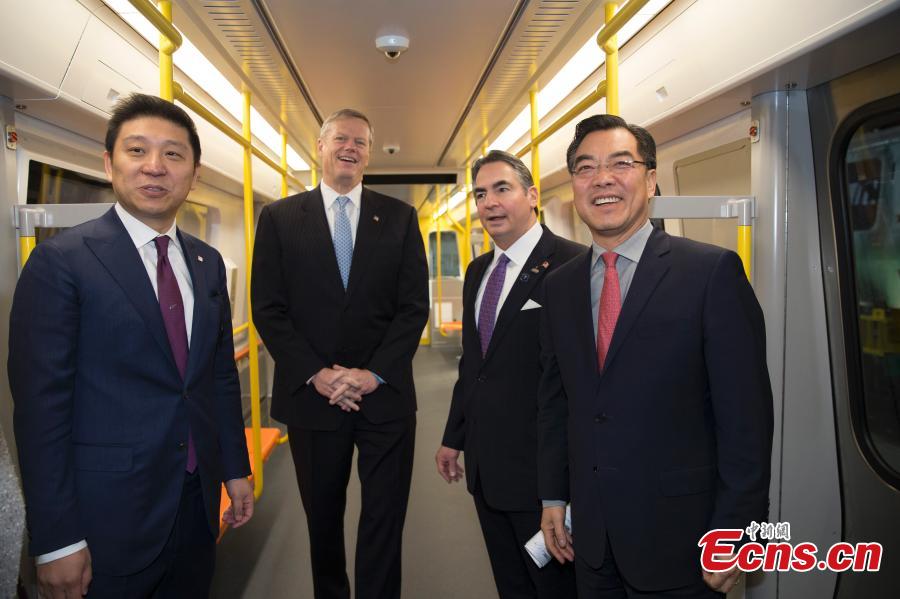 (L-R) CRRC MA President Jia Bao, Massachusetts Governor Charlie Baker, Springfield Mayor Domenic Sarno and Chinese Consulate-General in New York Huang Ping attend a ceremony to mark the first train by the CRRC factory in Springfield, Massachusetts, the United States. (Photo: China News Service/Liao Pan)