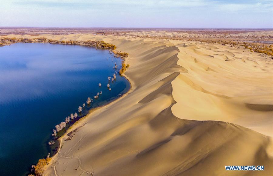Aerial photo shows the scenery of Lop lake and Taklimakan Desert in Yuli County, northwest China\'s Xinjiang Uygur Autonomous Region, Oct. 30, 2018. Colors make our world bright and beautiful. In 2018, Xinhua photographers across China explored views from the sky with drones. Here are these drone photos with amazing colors. (Xinhua/Li Fei)