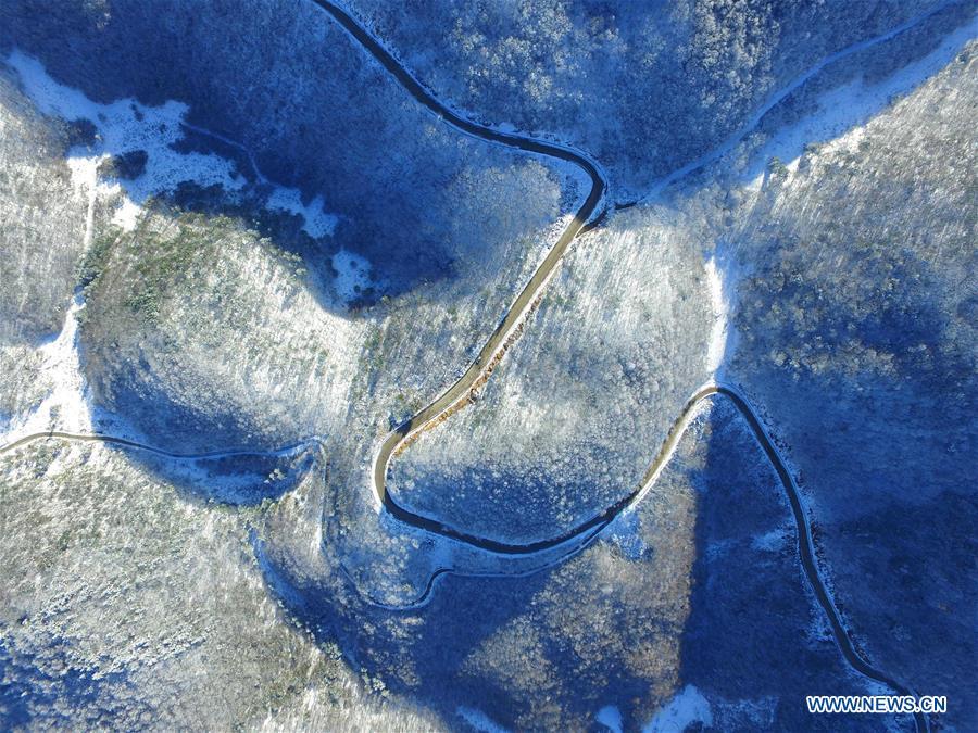 Aerial photo taken on Nov. 18, 2018 shows snow scenery at Dashui forest in Longping Town, Baokang County, central China\'s Hubei Province. Colors make our world bright and beautiful. In 2018, Xinhua photographers across China explored views from the sky with drones. Here are these drone photos with amazing colors. (Xinhua/Yang Tao)