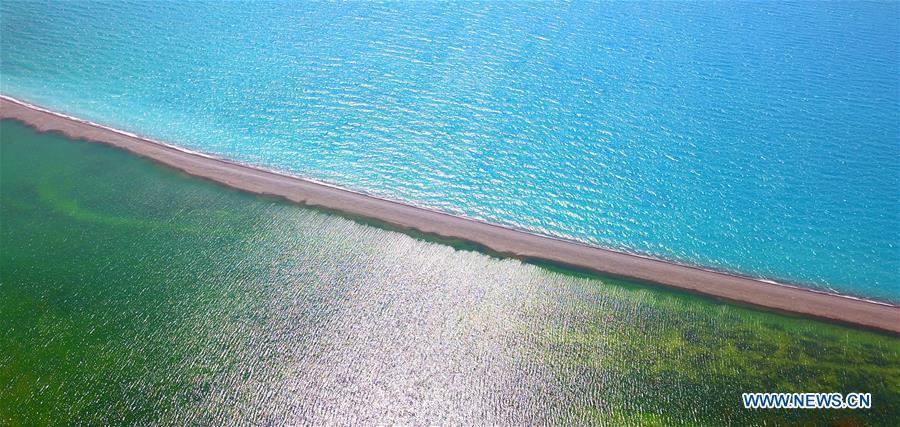 Aerial photo taken on July 18, 2018 shows the scenery of the Sayram Lake in northwest China\'s Xinjiang Uygur Autonomous Region. Colors make our world bright and beautiful. In 2018, Xinhua photographers across China explored views from the sky with drones. Here are these drone photos with amazing colors. (Xinhua/Xu Congjun)