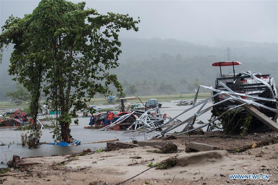 A baby stroller is seen on the beach after a tsunami hit Sunda Strait in Pandeglang, Banten province, in Indonesia, Dec. 23, 2018. The total casualty of a tsunami triggered by the eruption of Krakatau Child volcano has increased to 222 people in coastal areas of Sunda Strait of western Indonesia, disaster agency official said here on Sunday. The catastrophe killed at least 222 people, wounded at least 843 ones and collapsed a total of 556 houses and nine hotels, and caused damages to scores of ships. (Xinhua/Veri Sanovri)