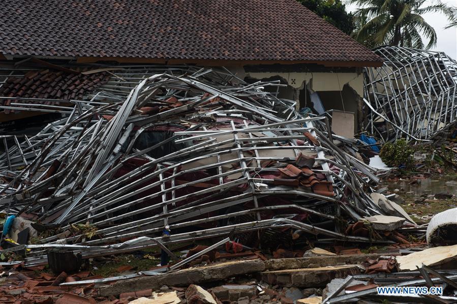 A car is buried in debris after a tsunami hit Sunda Strait in Pandeglang, Banten province, in Indonesia, Dec. 23, 2018. The total casualty of a tsunami triggered by the eruption of Krakatau Child volcano has increased to 222 people in coastal areas of Sunda Strait of western Indonesia, disaster agency official said here on Sunday. The catastrophe killed at least 222 people, wounded at least 843 ones and collapsed a total of 556 houses and nine hotels, and caused damages to scores of ships. (Xinhua/Veri Sanovri)