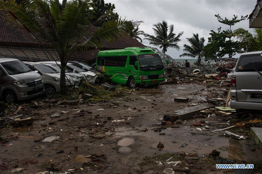 Vehicles are seen among the debris after a tsunami hit Sunda Strait in Pandeglang, Banten province, in Indonesia, Dec. 23, 2018. The total casualty of a tsunami triggered by the eruption of Krakatau Child volcano has increased to 222 people in coastal areas of Sunda Strait of western Indonesia, disaster agency official said here on Sunday. The catastrophe killed at least 222 people, wounded at least 843 ones and collapsed a total of 556 houses and nine hotels, and caused damages to scores of ships. (Xinhua/Veri Sanovri)
