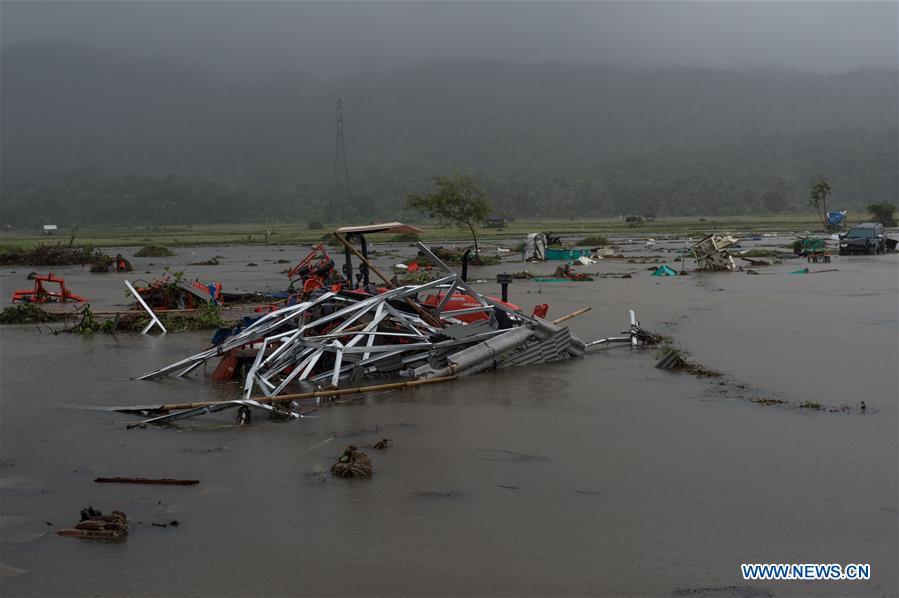 Cars and tractors are seen among debris after a tsunami hit Sunda Strait in Pandeglang, Banten province, in Indonesia, Dec. 23, 2018. The total casualty of a tsunami triggered by the eruption of Krakatau Child volcano has increased to 222 people in coastal areas of Sunda Strait of western Indonesia, disaster agency official said here on Sunday. The catastrophe killed at least 222 people, wounded at least 843 ones and collapsed a total of 556 houses and nine hotels, and caused damages to scores of ships. (Xinhua/Veri Sanovri)