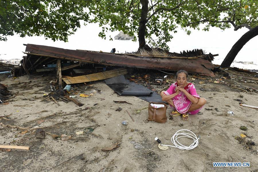 A woman sits by the debris of her kiosk near the beach in Carita after a tsunami hit Sunda Strait in Pandeglang, Banten province, in Indonesia, Dec. 23, 2018. The total casualty of a tsunami triggered by the eruption of Krakatau Child volcano has increased to 168 people in coastal areas of Sunda Strait of western Indonesia, disaster agency official said here on Sunday. The catastrophe killed at least 168 people, wounded at least 745 ones and collapsed a total of 430 houses and nine hotels, and caused damages to scores of ships. (Xinhua/Wahyu Wening)