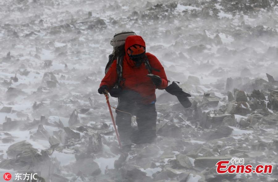 Chilean scientist Sebastian Vega examines a rock for lichens on Buchanan Hills, on the Union Glacier in the Ellsworth Mountains, Antarctica, Nov. 26, 2018. A group of eight researchers take part in the first activity of the LV Scientific Antarctic Expedition organized by the Chilean Antarctic Institute (INACH). The Glacier Union camp is a Chilean polar station operated by the three groups of the Armed Forces of Chile and the INACH, and marks the beginning of all scientific activities planned in the Antarctic territory for the summer season. Glacier Union is the third most southern camp of the continent and it is only open for a month. (Photo/Agencies)