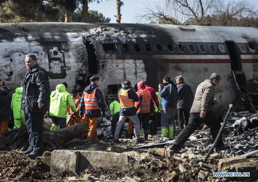 Rescuers work at the site of a Boeing 707 plane crash in Karaj, Iran, Jan. 14, 2019. At least 15 people were killed on Monday in the crash. (Xinhua/Ahmad Halabisaz)