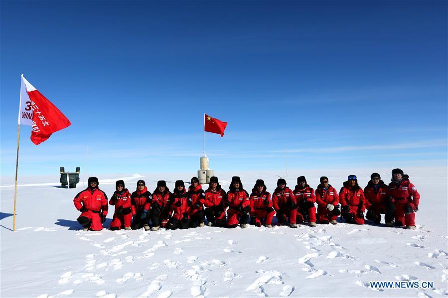 Members of China\'s 35th Antarctic expedition team pose for a group photo at the area of the Dome Argus (Dome A), the peak of Antarctica\'s inland icecap, in Antarctica, Jan. 16, 2019. (Xinhua/Liu Shiping)