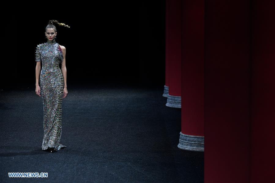 A model presents a creation of Guo Pei during the Haute Couture 2019 Spring/Summer collection shows in Paris, France, on Jan. 23, 2019. (Xinhua/Piero Biasion)
