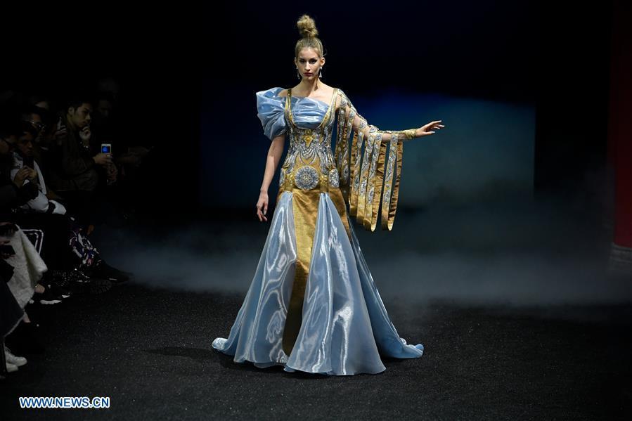 A model presents a creation of Guo Pei during the Haute Couture 2019 Spring/Summer collection shows in Paris, France, on Jan. 23, 2019. (Xinhua/Piero Biasion)
