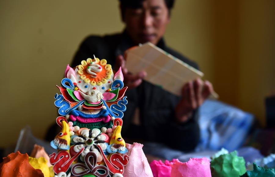 A carefully molded butter figurine pictured in Lhasa, Jan. 22, 2019. (Photo/Xinhua)