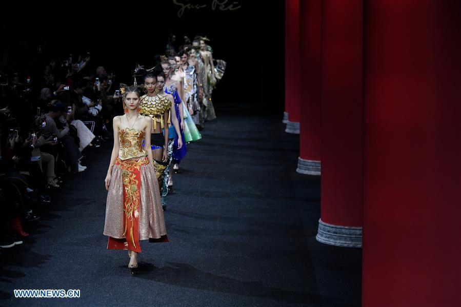 Models present creations of Guo Pei during the Haute Couture 2019 Spring/Summer collection shows in Paris, France, on Jan. 23, 2019. (Xinhua/Piero Biasion)