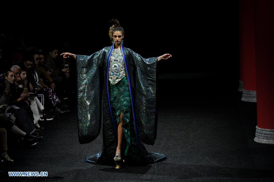 A model presents a creation of Guo Pei during the Haute Couture 2019 Spring/Summer collection shows in Paris, France, on Jan. 23, 2019. (Xinhua/Piero Biasion)