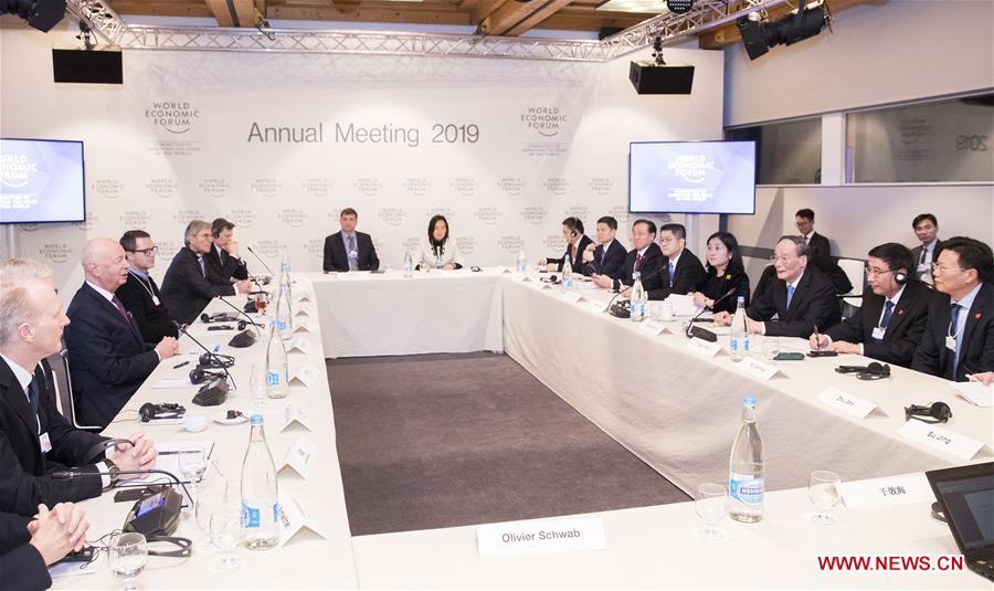 Chinese Vice President Wang Qishan attends a symposium with figures from international industrial and commercial circles during the 2019 Annual Meeting of the World Economic Forum in Davos, Switzerland. Wang delivered a speech titled \