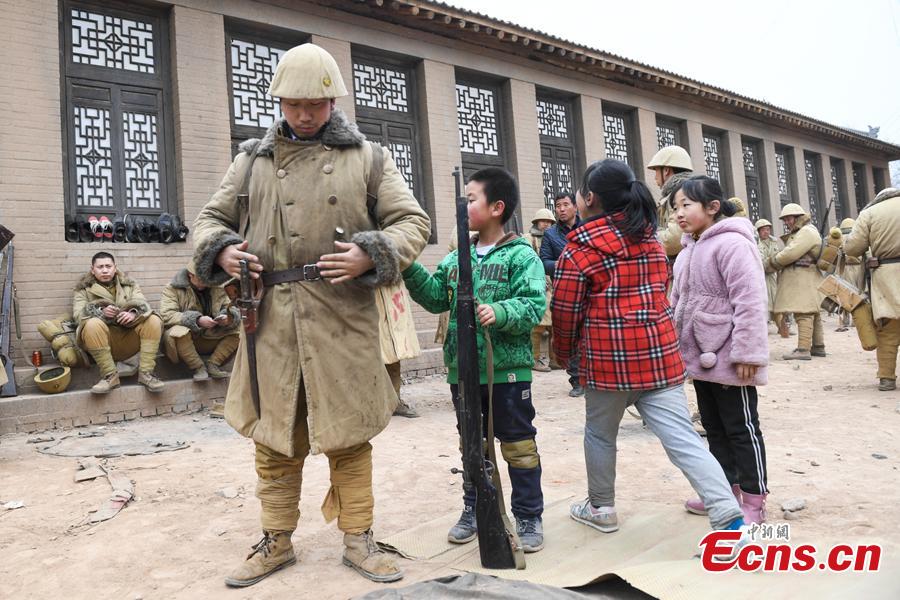 Li Tieliang\'s son works as extra in a TV drama being shot in Beishanyun Village in Yushe County, North China’s Shanxi Province, Jan. 24, 2019. The village has more than 30 well-preserved buildings from the Ming and Qing dynasties, making it a good location to shoot historical film and TV dramas. In recent years, many locals have migrated to other places, while some remaining farmers have found work as extras. Li and his wife survive by farming, while their children work in other cities. Li now works part-time as an extra and earns about 100 yuan ($14) a day. (Photo: China News Service/Wu Junjie)