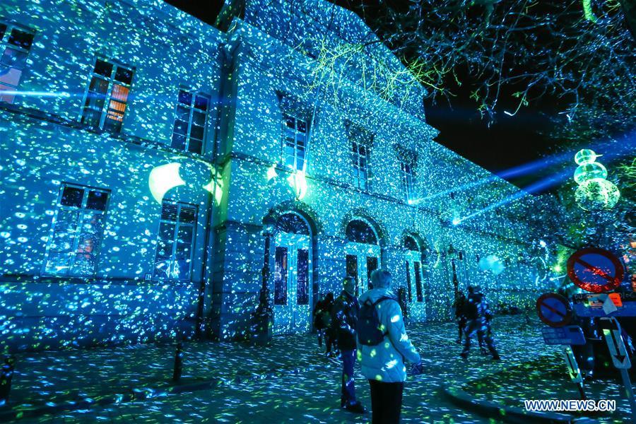 Visitors view an artistic light installation on the Bright Brussels Festival in Brussels, capital of Belgium, Feb. 14, 2019. Featuring a dozen of light installations, Bright Brussels Festival is held from Feb. 14 to Feb. 17, aiming to present the magic of light to the public. (Xinhua/Zhang Cheng)