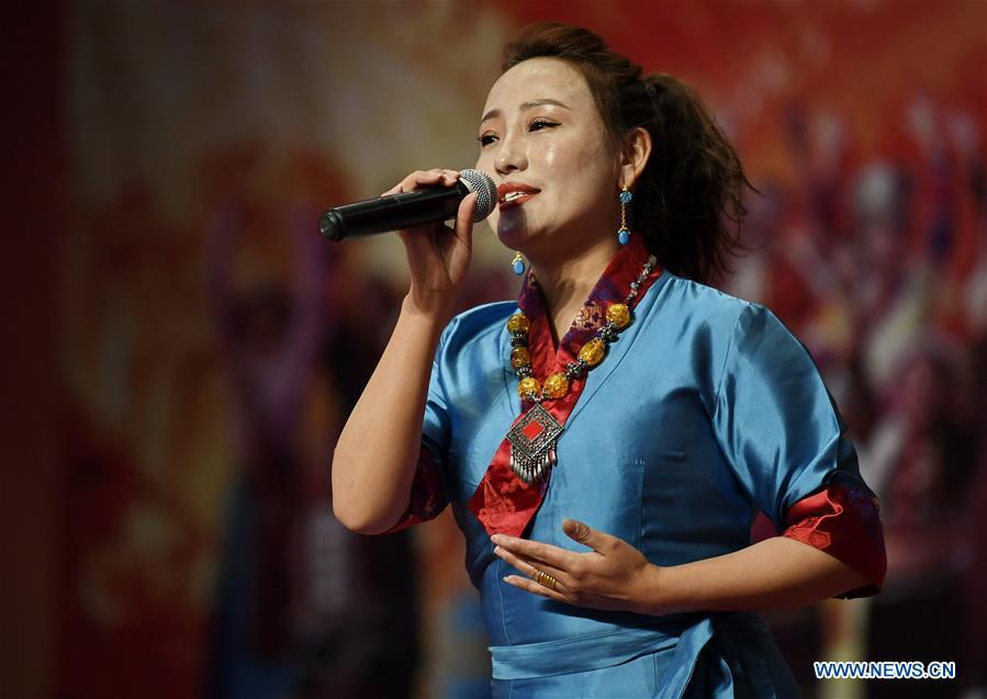 A singer sings during a performance to mark Tibet\'s Serfs\' Emancipation Day in Shannan, southwest China\'s Tibet Autonomous Region, March 26, 2019. Serfs\' Emancipation Day was formally established on March 28. (Xinhua/Zhang Rufeng)