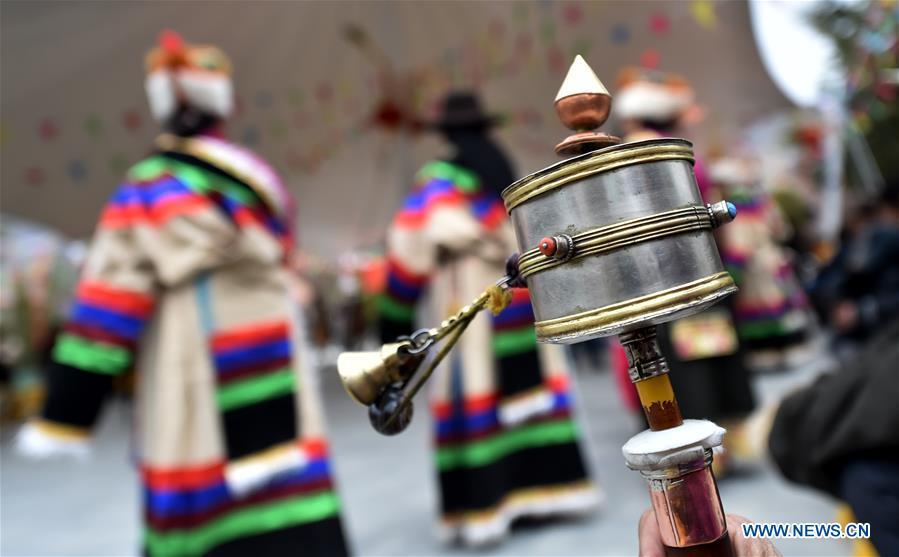 People attend an event to celebrate the 60th anniversary of democratic reforms in Tibet, at a community in Lhasa, capital of southwest China\'s Tibet Autonomous Region, March 23, 2019. (Xinhua/Chogo)