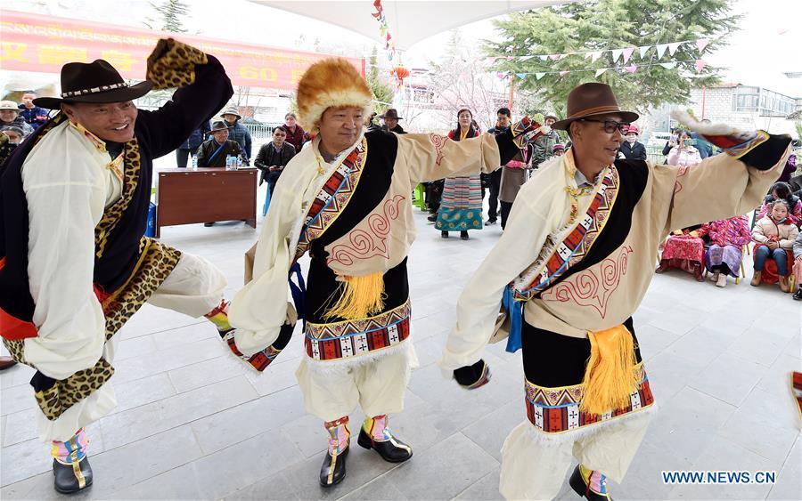 People dance to celebrate the 60th anniversary of democratic reforms in Tibet, at a community in Lhasa, capital of southwest China\'s Tibet Autonomous Region, March 23, 2019. (Xinhua/Chogo)