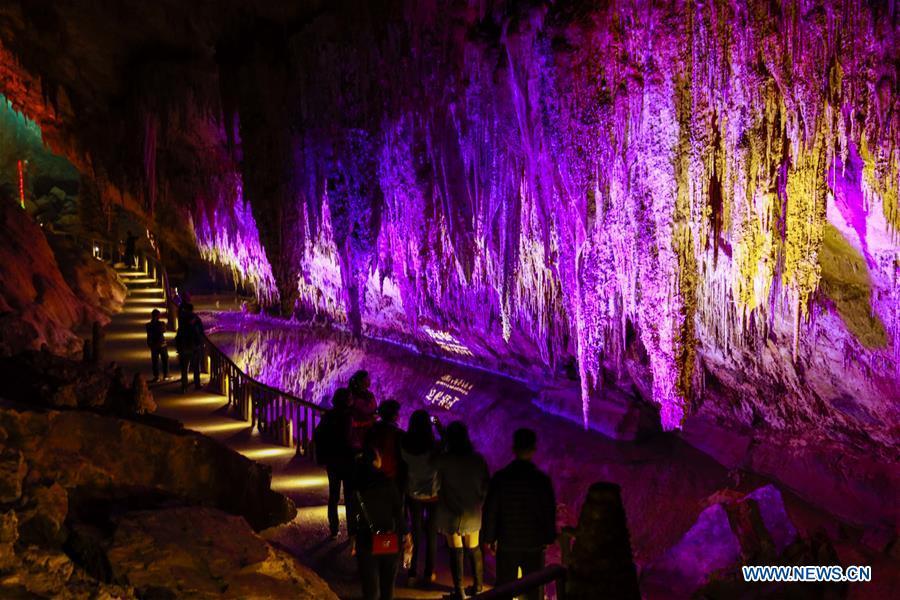 Tourists view the karst landscape inside the Furong Cave in Wulong District of Chongqing, southwest China, March 26, 2019. The Wulong Furong Cave was listed as a UNESCO world natural heritage site in 2007. (Xinhua/Dong Jianghui)
